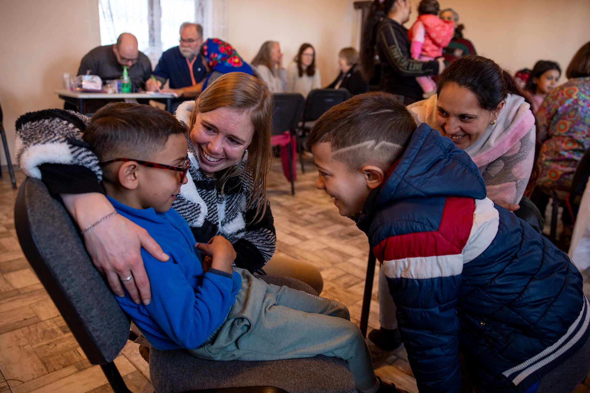 Missionary, Alicia Jones loving on and talking with a Roma child during a medical clinic in Romania.